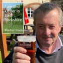 Caption Martin Limon and (inset) his book entitled Law and Order in East Yorkshire