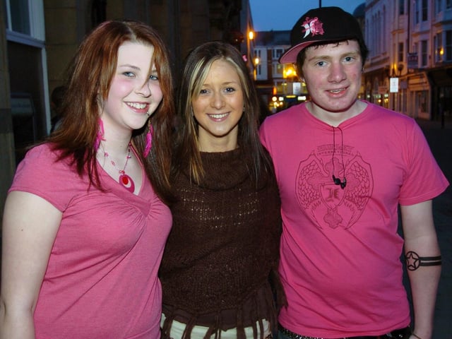 Birthday girl Megan celebrates her special day with friends Annie and Mark.