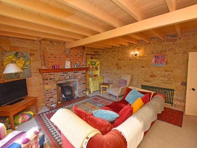 This rustic and cosy lounge also has a feature fireplace.