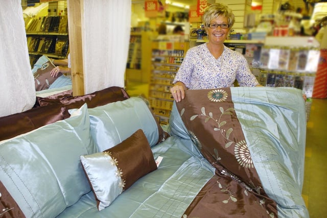 Boyes sales assistant Cathy Fletcher with bedspread in 2008.