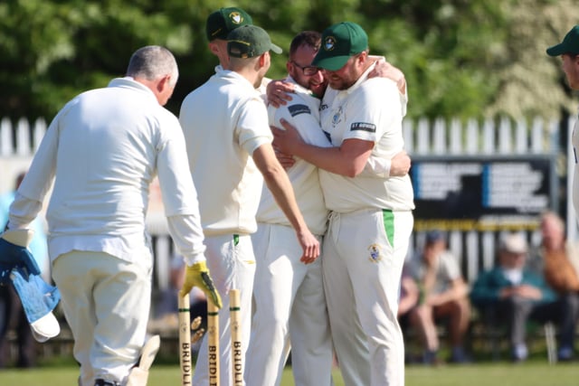 Bridlington CC 2nds celebrate taking a Sewerby wicket.
