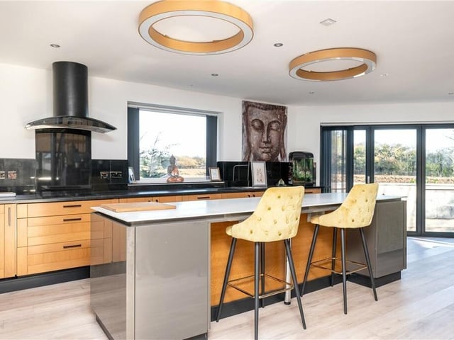 The fitted kitchen with breakfast bar.