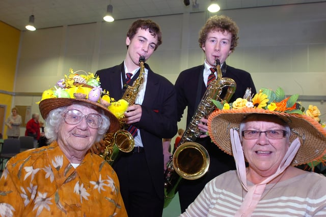 Bella Strutt (left), aged 96, and Madge Taylor, aged 68, both of Edlington, are pictured with their bonnets at The Easter Tea Party at Sir Thomas Wharton Community College in 2009 Providing some musical entertainment are Nick Brusby (left), aged 14, and George Brookfield, aged 15.