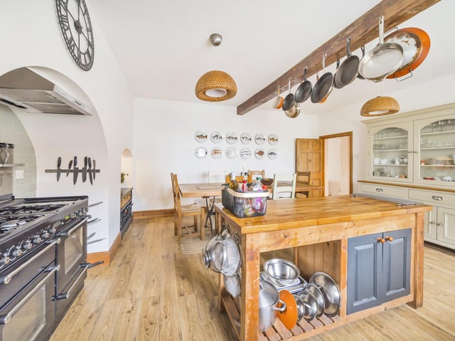 The beamed farmhouse kitchen with diner.
