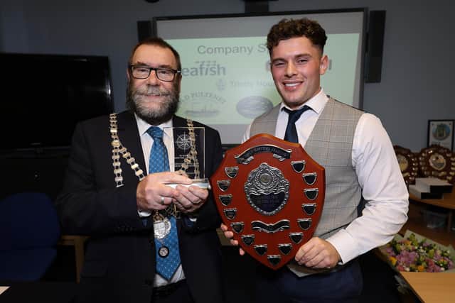 Whitby Mayor Robert Dalrymple presents Keane Stevenson with his award.
picture: Richard Ponter