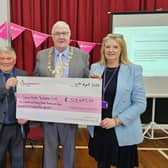 Coun Clive Pearson, Chair of North Yorkshire Council - David Ireton and Debbie Swales at the cheque presentation.