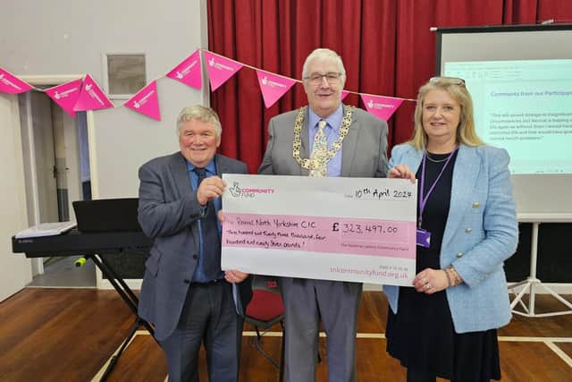 Coun Clive Pearson, Chair of North Yorkshire Council - David Ireton and Debbie Swales at the cheque presentation.