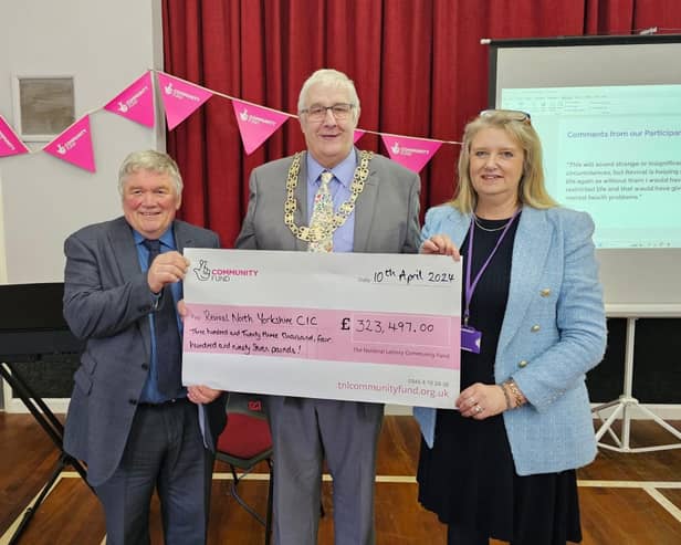 Coun Clive Pearson, Chair of North Yorkshire Council - David Ireton and Debbie Swales at the cheque presentation.