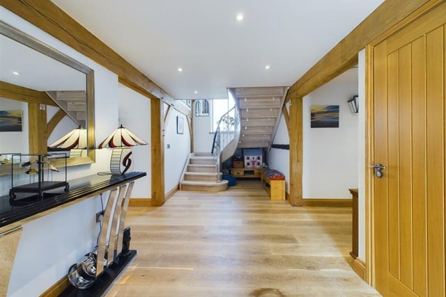 A bespoke staircase leads up tot he first floor from the spacious entrance hall.