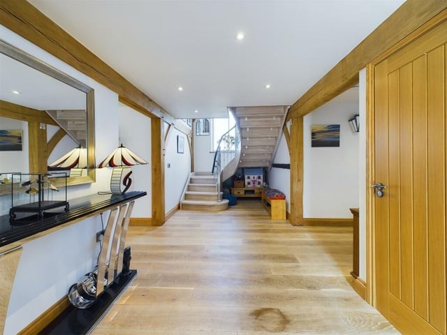 A bespoke staircase leads up tot he first floor from the spacious entrance hall.