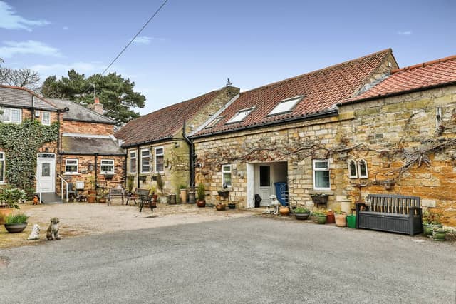 The approach to the quaint five-bedroom cottage in the grounds of Throxenby Hall.