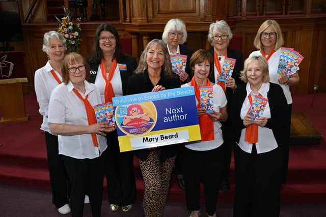Festival organiser Heather French, centre, and Books by the Beach volunteers (credit: Richard Ponter)
