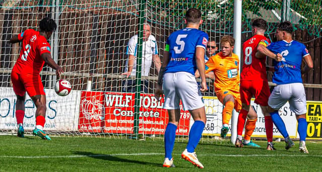 A home effort is ruled not to have crossed the line during the 3-1 home loss for Whitby Town against Warrington Rylands. PHOTOS BY BRIAN MURFIELD