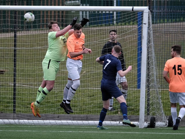 An aerial duel in the County Cup
