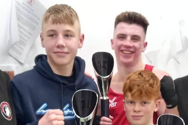 Riley Wilford, 13, front right, won on his boxing debut.