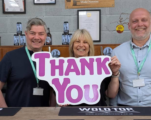 Events coordinator Sam Smith (centre) with Angus Robson and Peter Beard (St Catherine's Hospice)