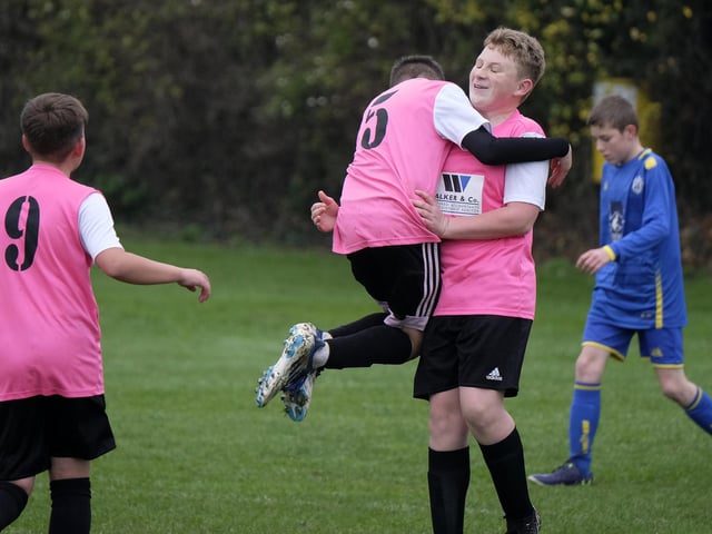 Lee Cappleman is congratulated by his Ayton Under-13s teammates after scoring against Eastfield