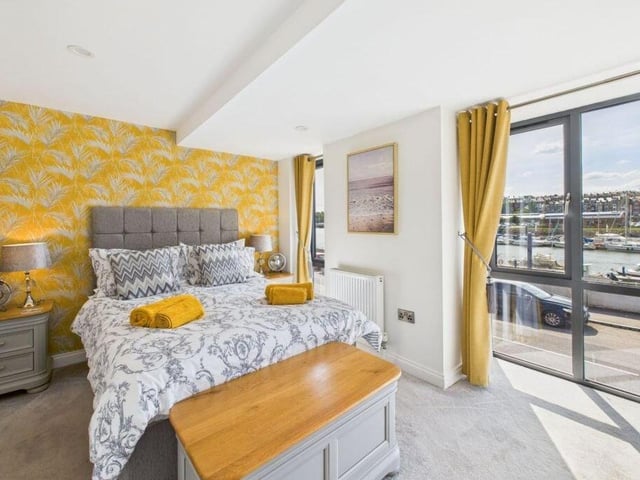 A bedroom with a stunning view, and outdoor access.