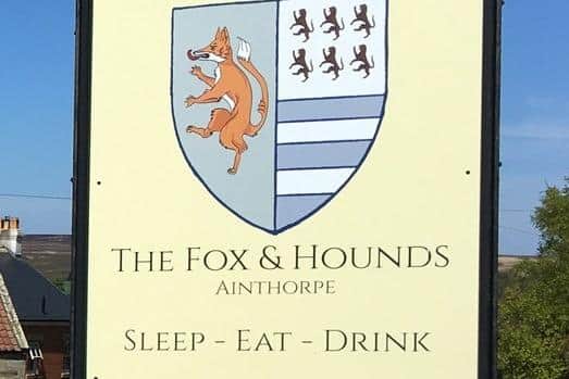 Sign for the Fox and Hounds pub at Ainthorpe.
