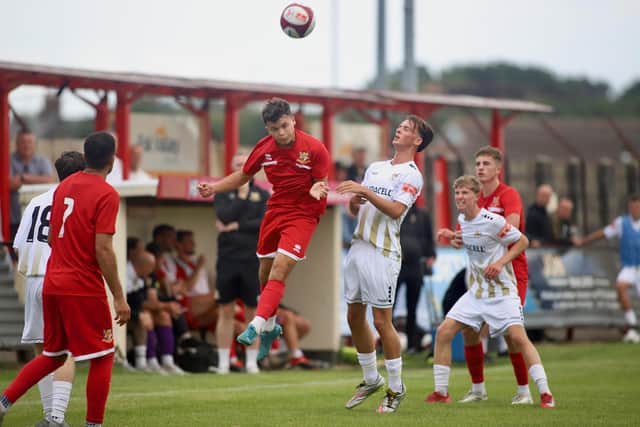 Bridlington Town head clear during the friendly against Bridlington Town SFS U19s. Photo by TCF Photography