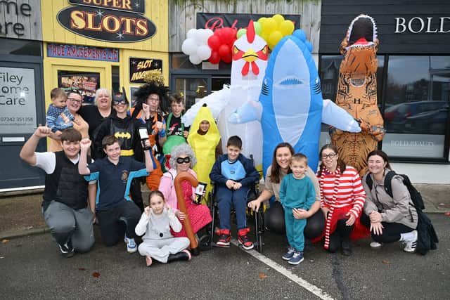 Team Archie! - Archie with family and fundraisers at Ruby's Cafe