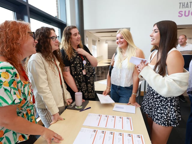Students chat to staff.