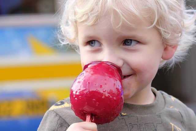 Enjoying a traditional treat at the 2019 fair.