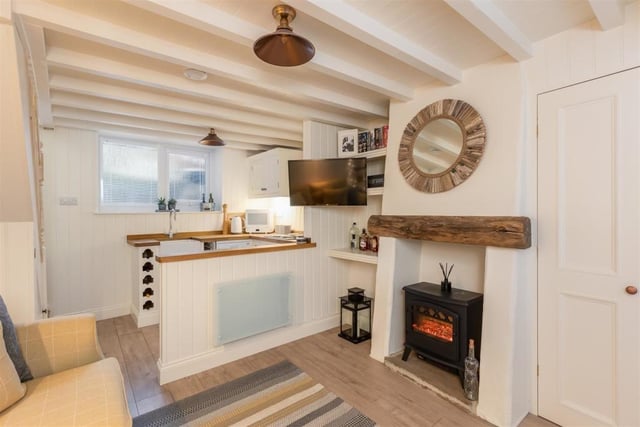 An ope plan kitchen to sitting room is part of the accommodation inside the quaint one-bedroom cottage in Runswick Bay.