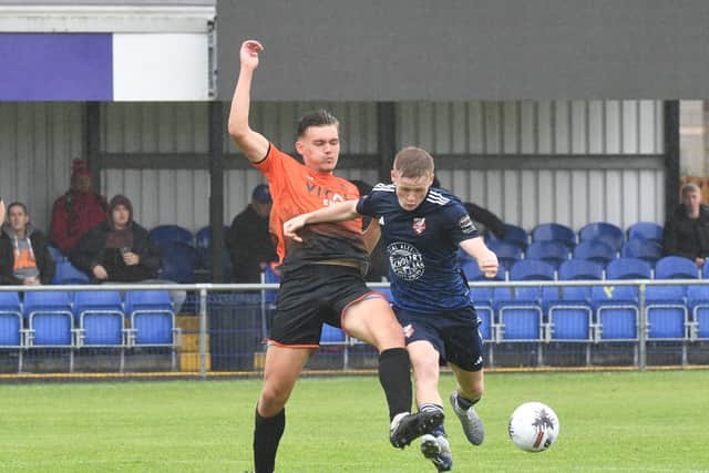 Boro's Harry Green looks to get past the Sports defence..