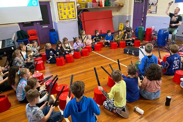 Students at Pickering Community Junior School take part in their free music holiday club.