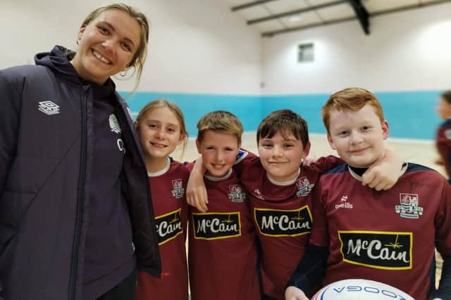New Red Roses captain Zoe Aldcroft pictured with local youngsters at a training session last year