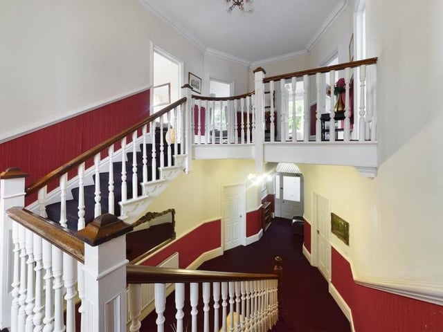The majestic hallway, stairs and landing within the sizeable property.
