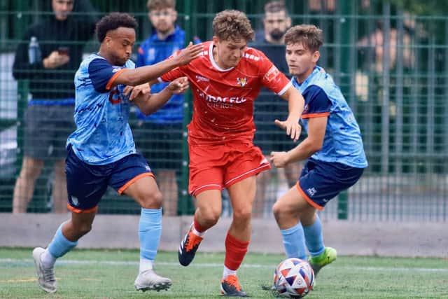 Bridlington Town, red kit, lost 2-1 at Bottesford Town. Photo by TCF Photography