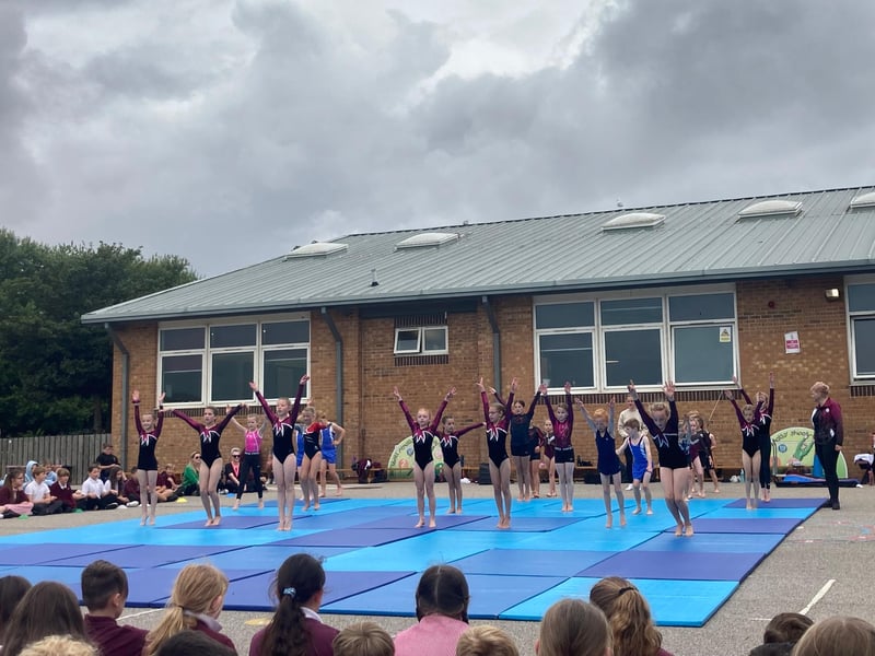 The whole school came outside to watch the gymnastics squad's performance, alongside teachers and parents.