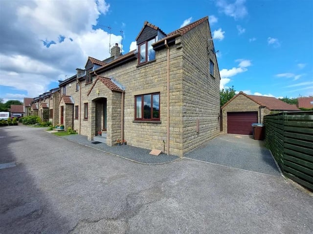 This four bedroom and two bathroom end terraced house is for sale with Colin Ellis with a guide price of £300,000.