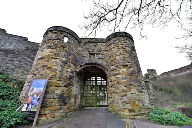 Scarborough Castle entrance, with inscriptions on the cobbles leading to the gate.
picture: Richard Ponter