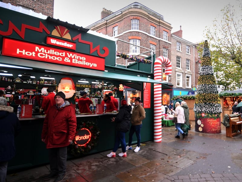 People line up at the Mulled Wine, Hot Dog and Baileys stall.
