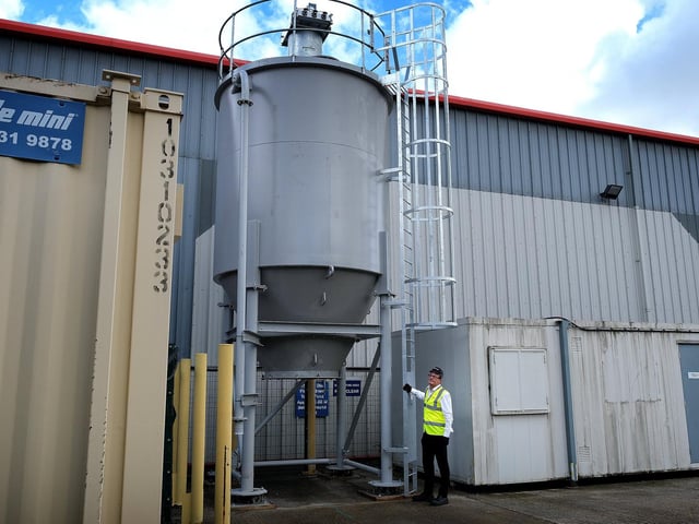 David Pout shows off one of the Rotoflo's, fitted to a silo in the testing area of the factory.