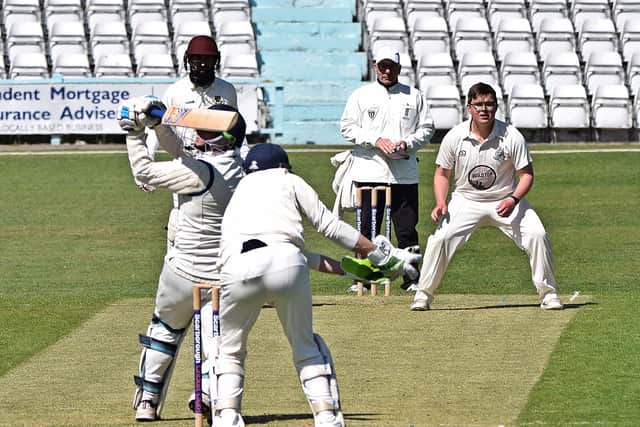 Dan Artley takes a superb catch off the bowling of Archie Hammond. Photo by Simon Dobson