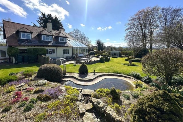 A scenic pond and rockery is a feature in the gardens.