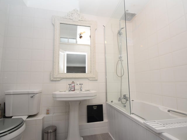 One of six bathrooms within the property.