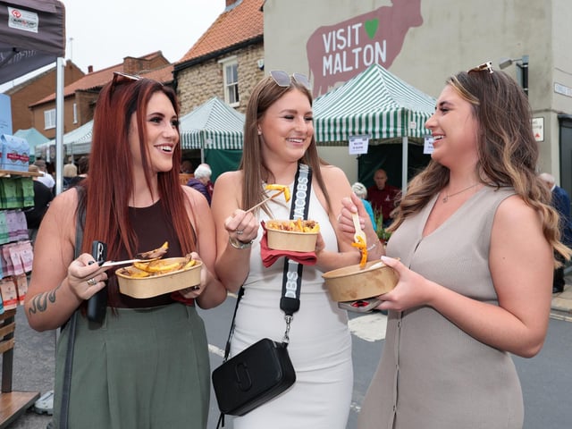 Enjoying some food from one of the range of stalls.picture: Richard Ponter, Visit Malton CIC