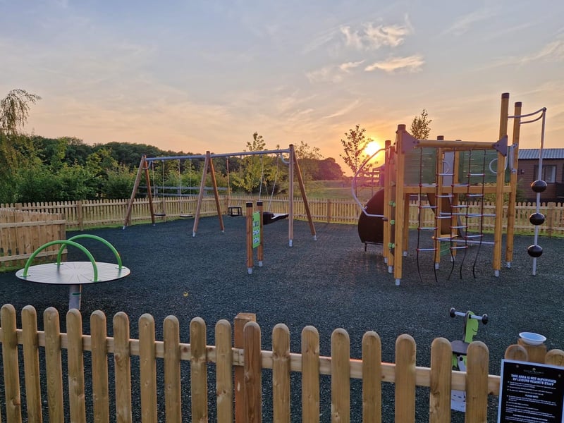 The sun sets over the play area at the end of a beautiful day