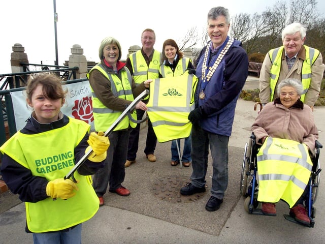 Rotary Club of Scarborough President Alan Mitchel presents high vis tabards to Friends of South Cliff members (from left) Alice Robinson (9), Jane Mitchell, Frank and Amanda Robinson, Richard and Maggie Flowitt. 071396