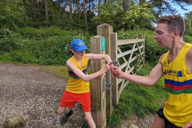 Scarborough AC's Paul Lawton to Alfie Carr at the Cleveland Way Relay.