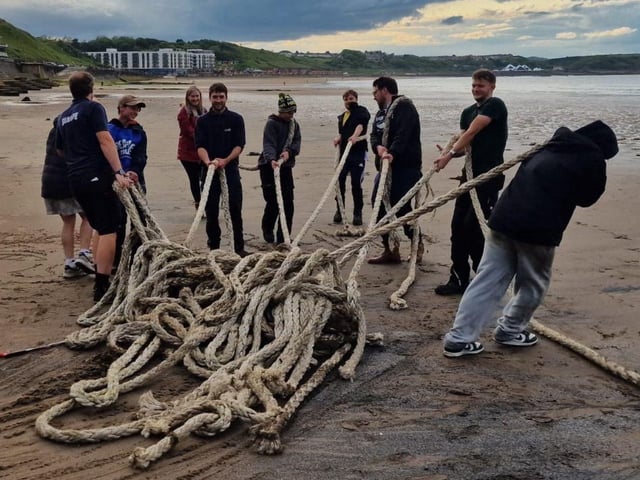 Karl and the team take part in a beach clean.