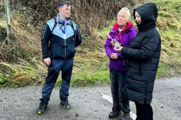 Harry Schofield is presented with John Hunter's Cleveland Way relay trophy by his sister Joyce and partner Val (pictured holding the trophy).