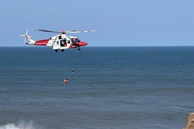 The casualty was secured in a rescue strop and lifted to safety.