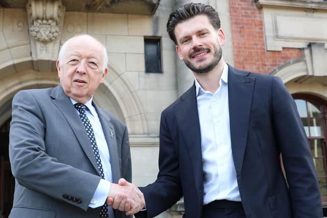 Councillor Carl Les and Councillor Keane Duncan shake hands after agreeing a deal that ended the contest to lead North Yorkshire Council into next year's local elections