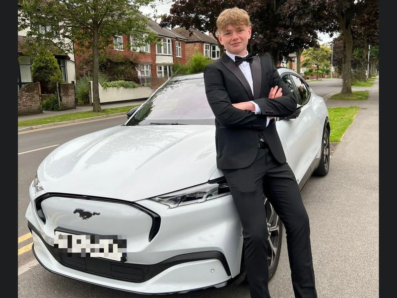 A smart suit with a fantastic car.